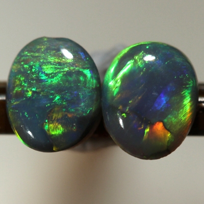 SOLID SEMI BLACK OPALS Matching pair. Bright multicolour
